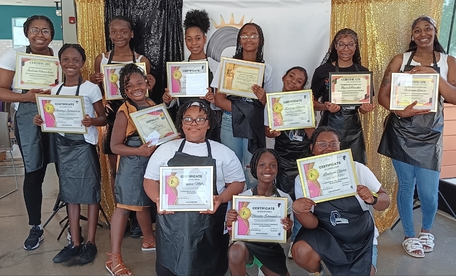 Beautypreneur Foundation hair camp graduates holding certificates